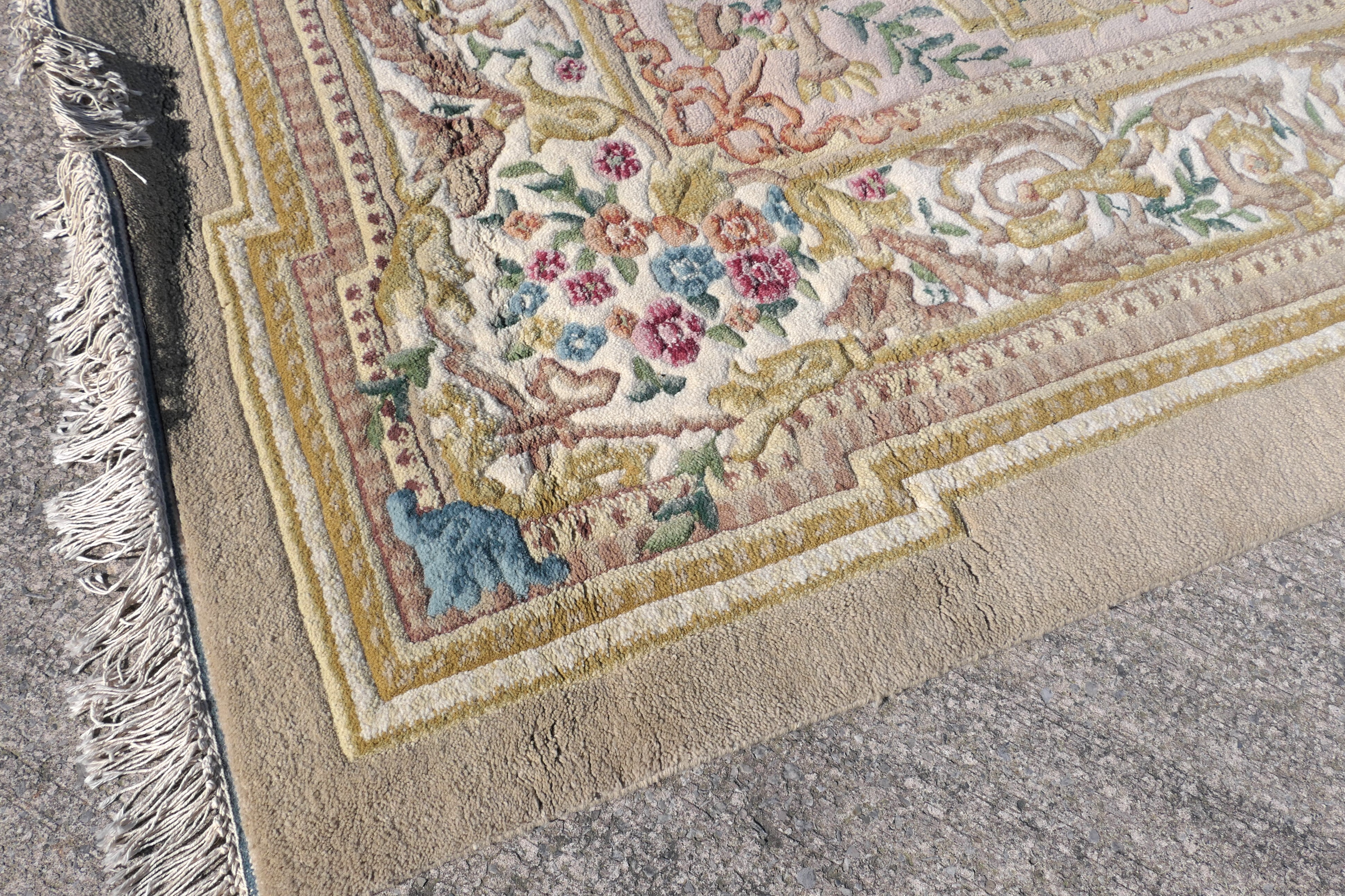 A large wool carpet with central medallion and floral border surround, - Image 3 of 7