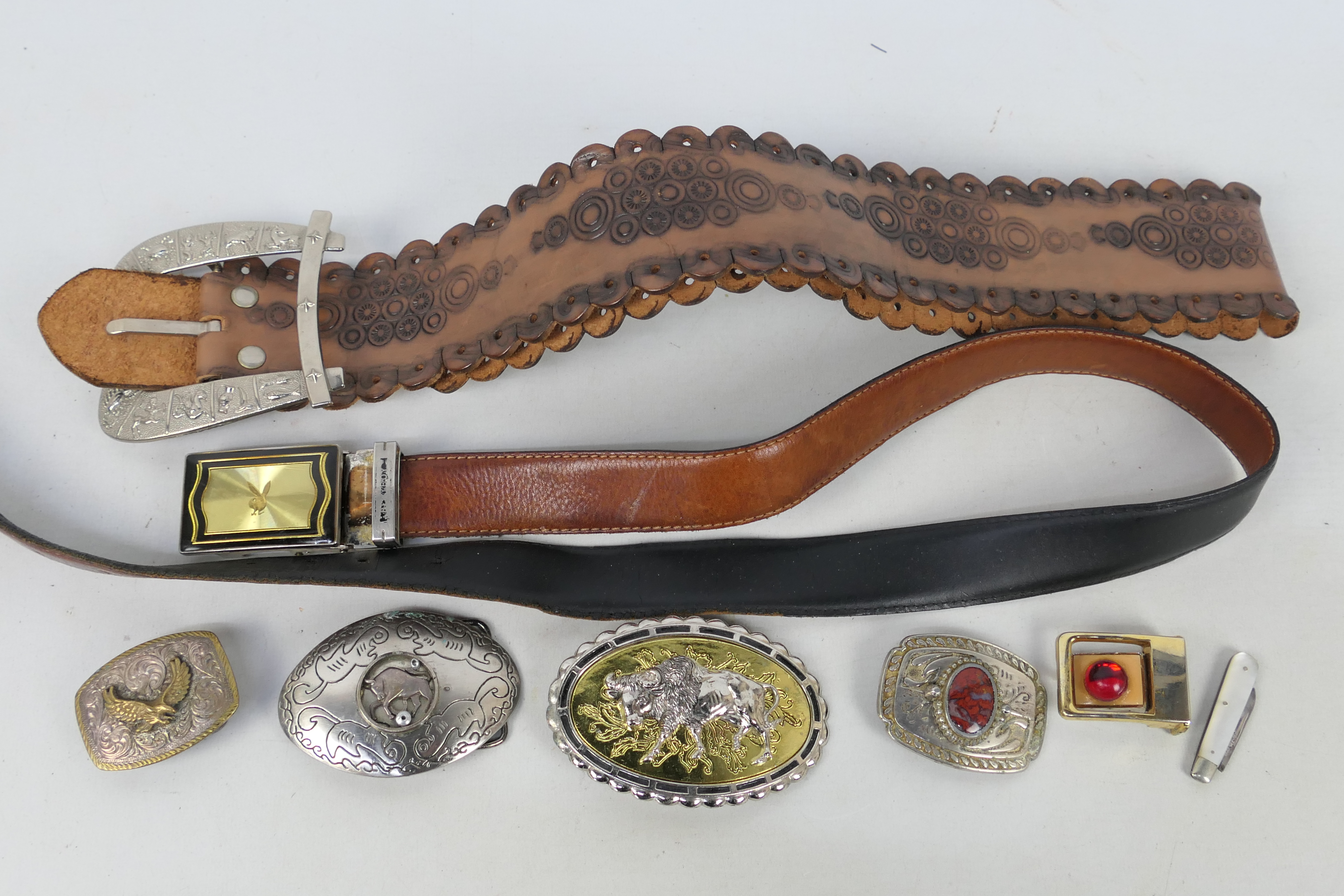 A collection of vintage belts and belt b