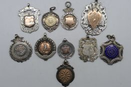 A collection of ten silver sporting meda