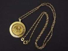 A 1981 1/10 ounce Krugerrand coin in 9ct yellow gold pendant mount suspended from a 9ct yellow gold