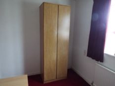 A light wood twin door wardrobe measuring approximately 198 cm x 69 cm x 51 cm.