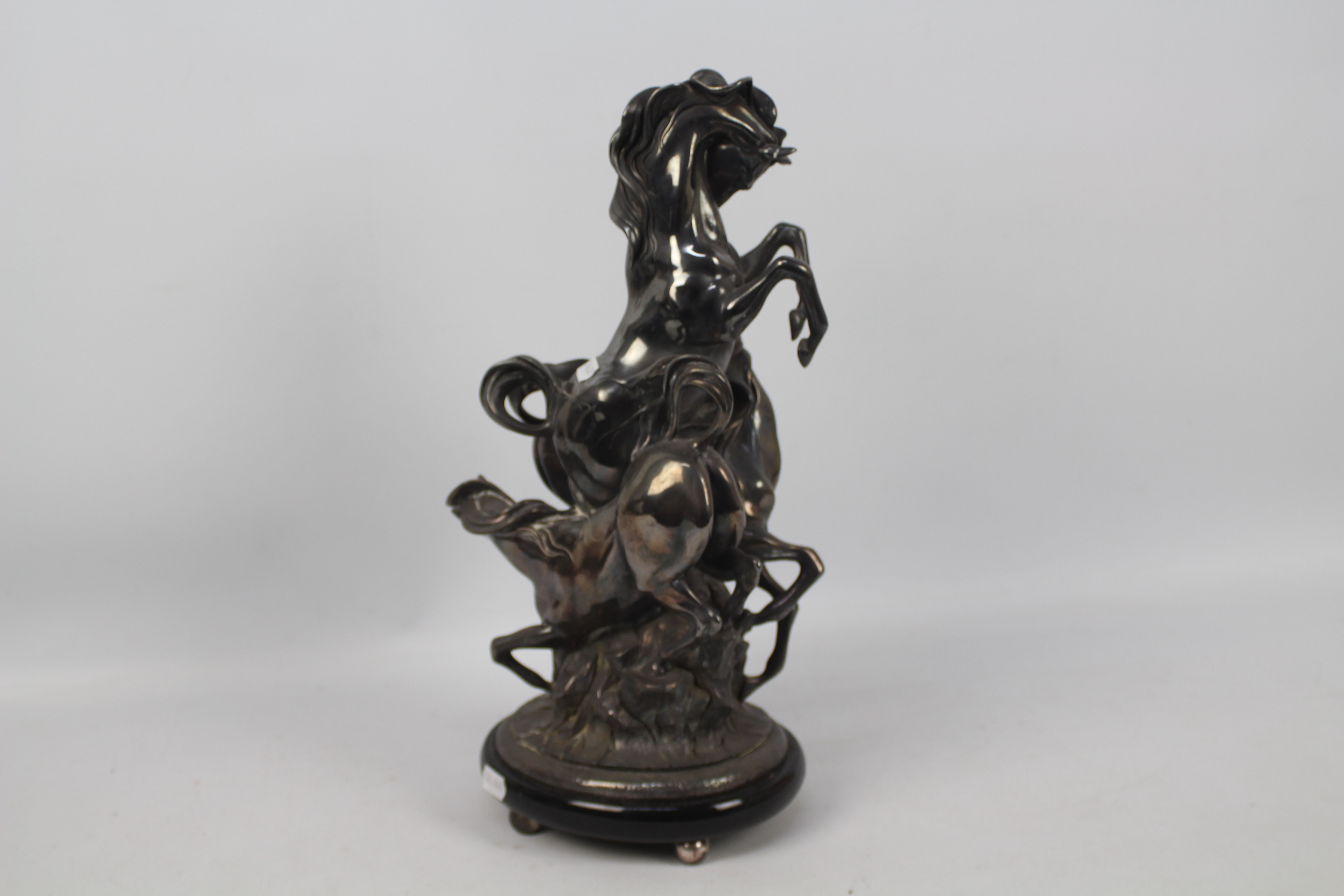 Ottaviani (Italian), 20th century - A silvered sculpture of three horses surmounting a rock, - Image 3 of 7