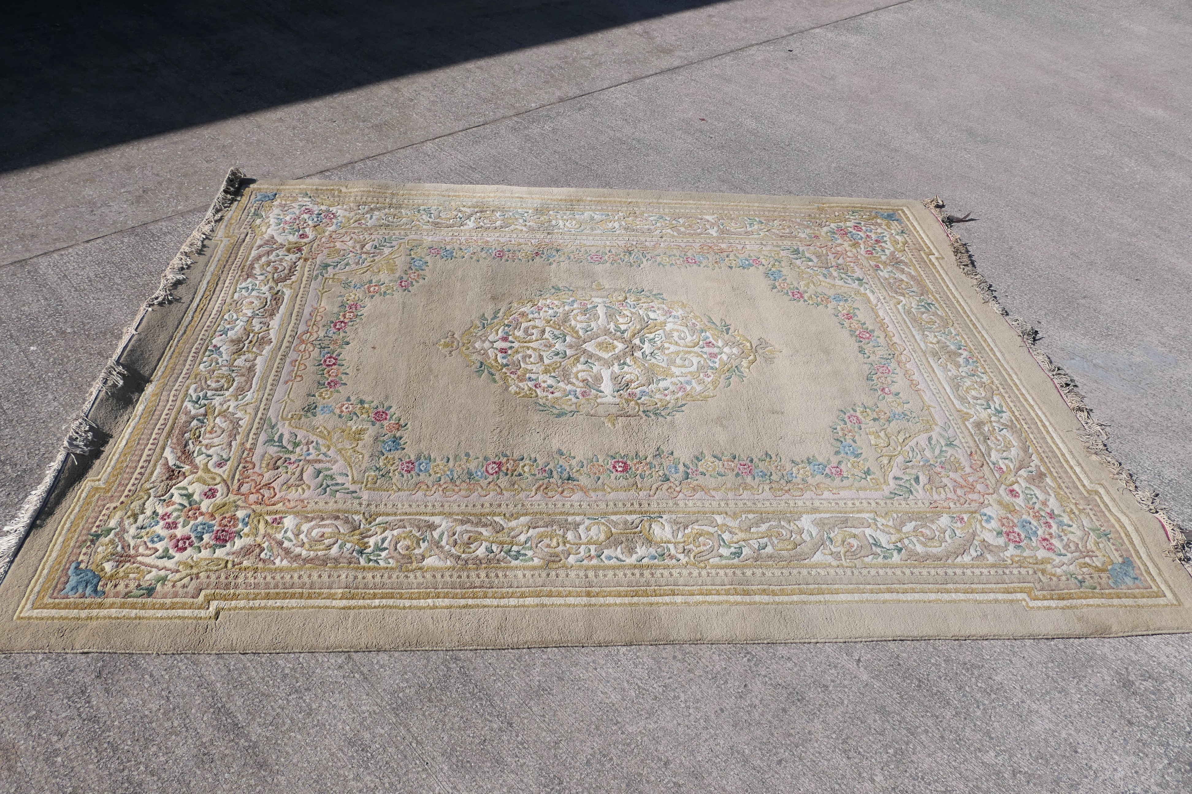 A large wool carpet with central medallion and floral border surround, - Image 2 of 7