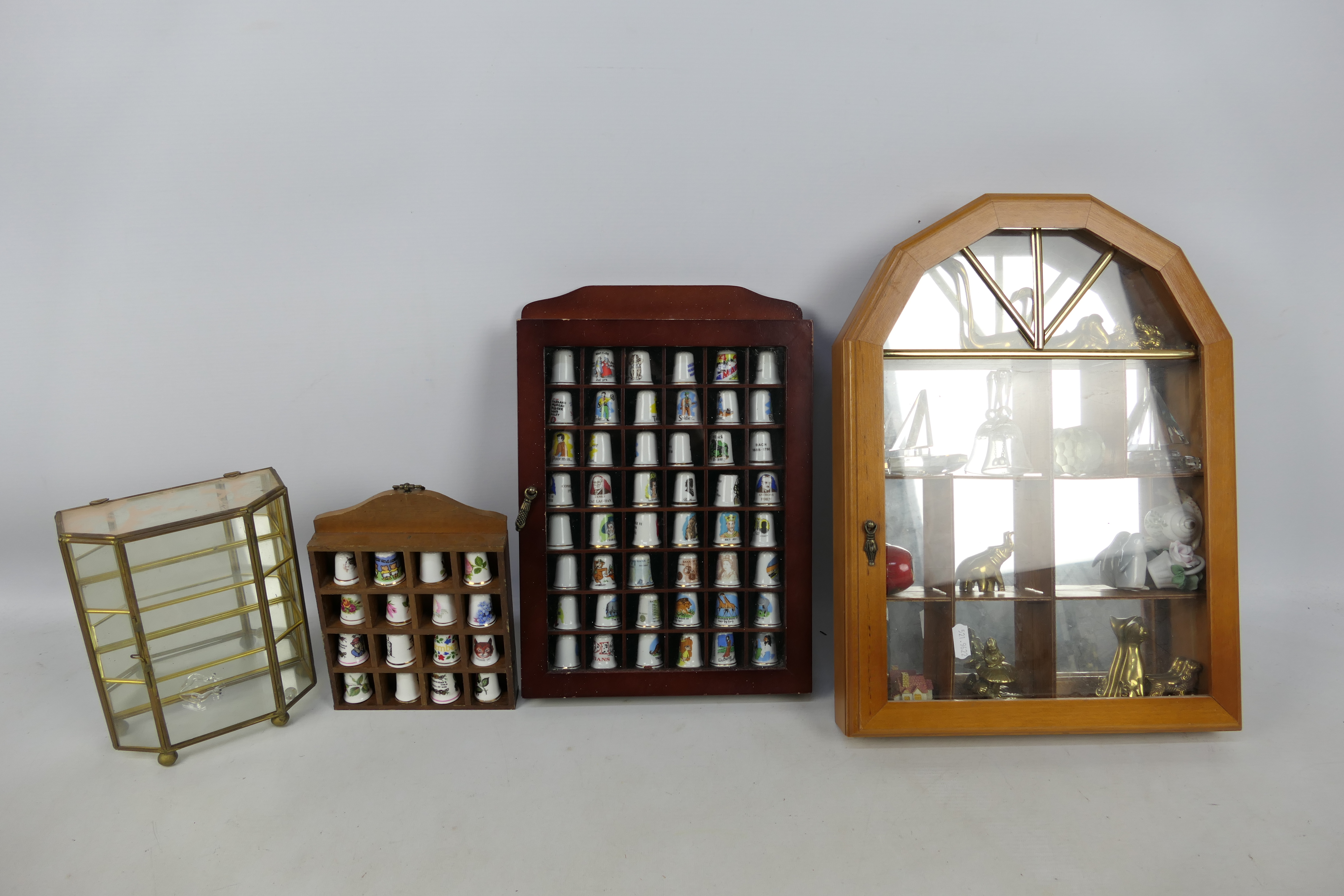 Various display cases containing thimble