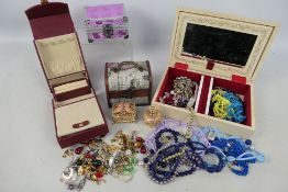 Jewellery boxes and a quantity of costume jewellery.