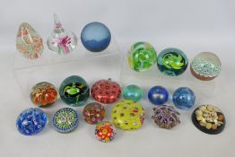 A collection of various paperweights to