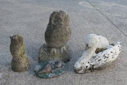Four reconstituted stone garden ornaments, largest approximately 43 cm (h).