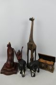 Carved wood elephants, giraffe group, coffer form cigarette box and similar.