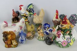 A collection of decorative figures of chickens and cockerels, varying sizes.