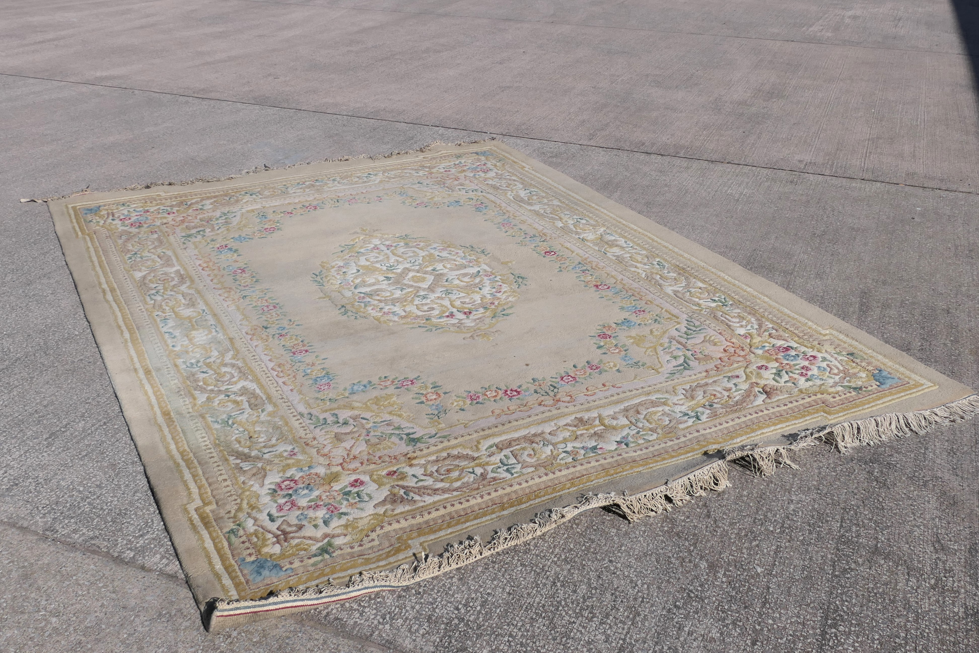 A large wool carpet with central medallion and floral border surround, - Image 7 of 7