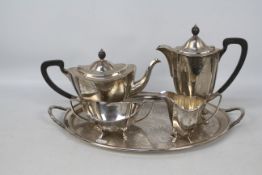 A silver plate tea service with tray.