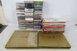 A quantity of compact discs and vinyl re