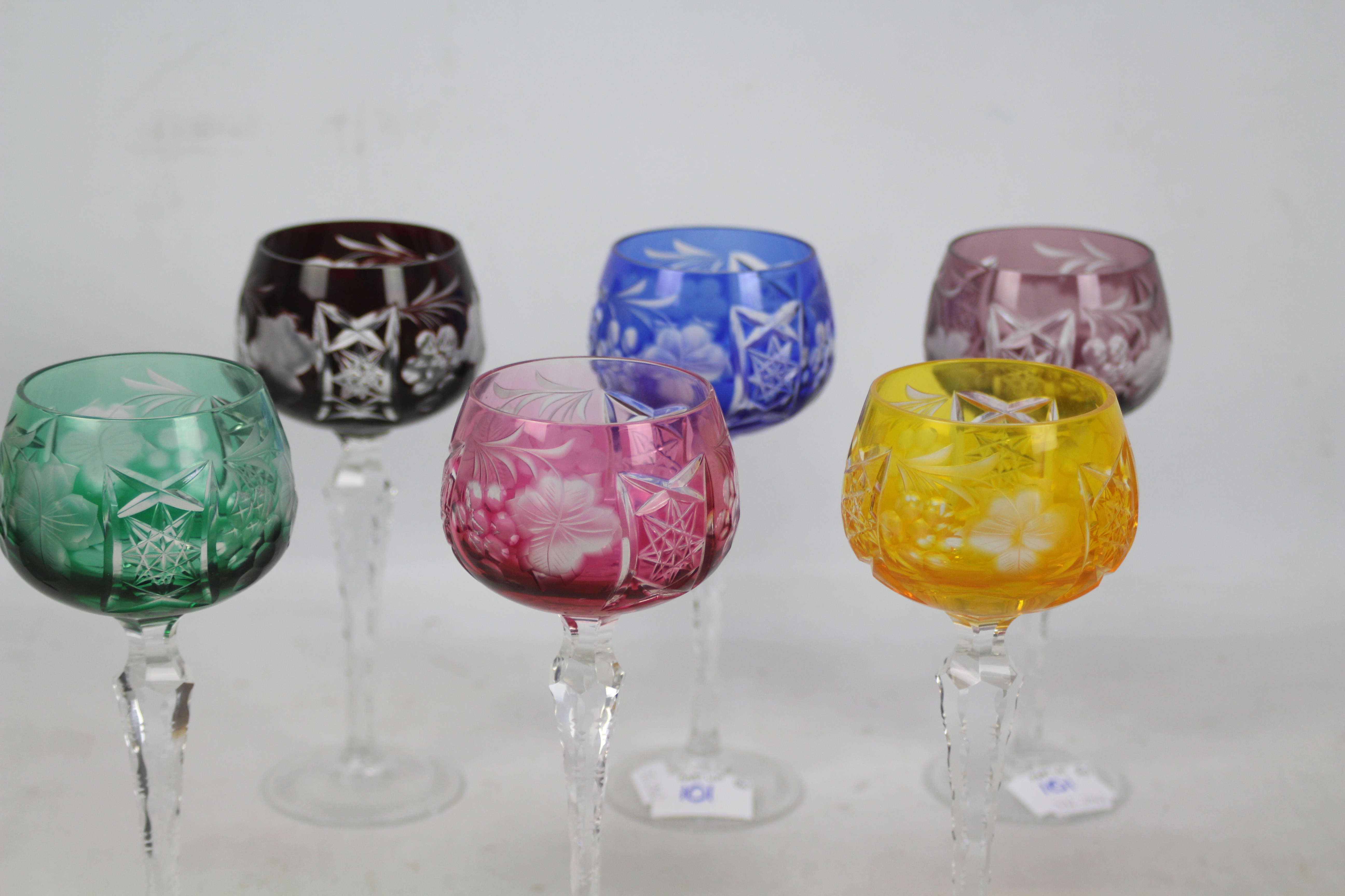 A set of six Harlequin coloured glass to clear hock glasses on faceted stems and spreading feet, - Image 2 of 2