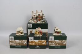 Lilliput Lane - Four boxed Christmas themed model cottages comprising three from the Snow Place
