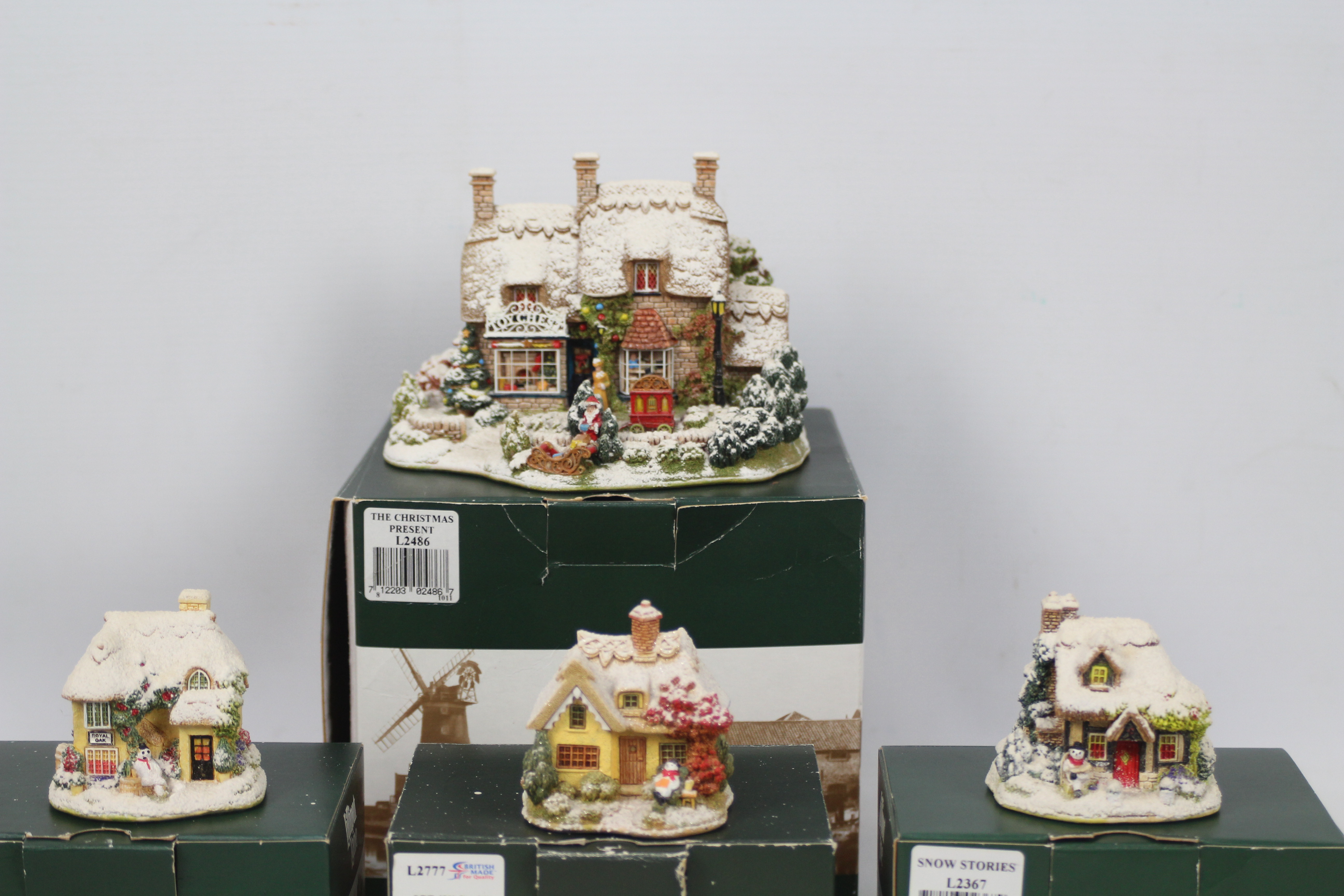 Lilliput Lane - Four boxed Christmas themed model cottages comprising three from the Snow Place - Image 2 of 4