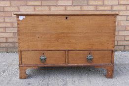 A mule chest having hinged lid with two drawers below, raised on bracket supports,