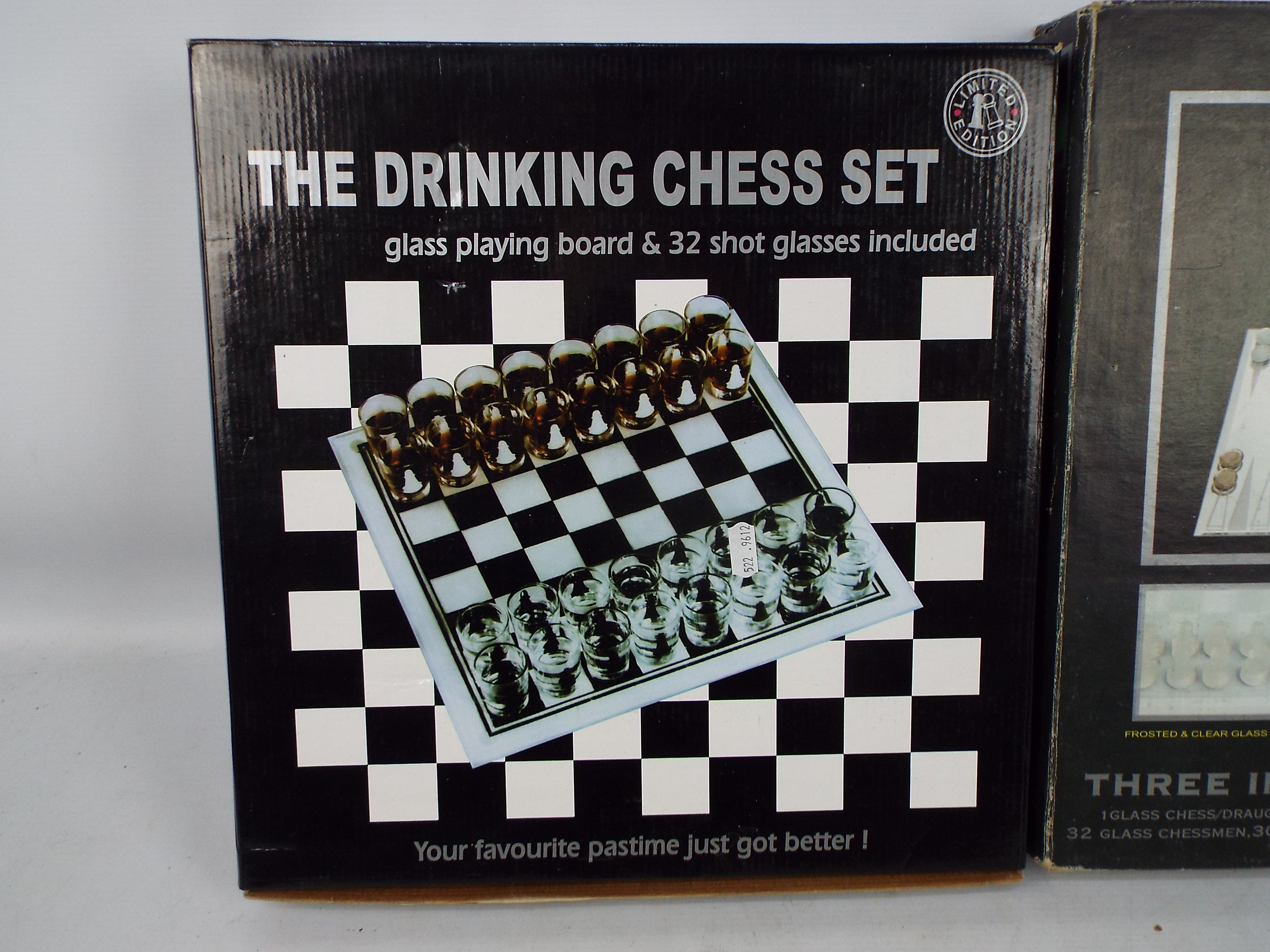 A 3 in 1 glass games compendium and a glass shot glass chess set, both boxed. - Image 2 of 3