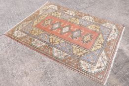 A carpet with geometric floral decoration, approximately 280 cm x 208 cm.