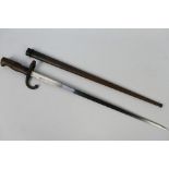 A 19th century French Gras bayonet, St Etienne, 52 cm blade, with scabbard.