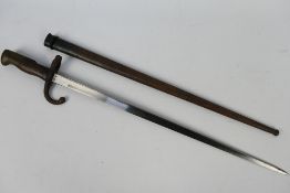 A 19th century French Gras bayonet, St Etienne, 52 cm blade, with scabbard.