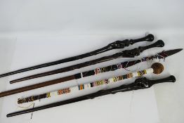 Ethnographica - A collection of African tribal staffs / spear with beadwork wrapped examples,
