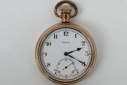 A Prima gold plated, open face pocket watch, the signed white dial with Arabic numerals,