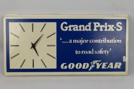 An advertising wall clock for Goodyear Grand Prix - S Tyres, approximately 29 cm x 59 cm.