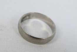 A wedding band stamped PD 500 for palladium, size T+½, approximately 3.