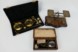 Three set of vintage scales comprising a set of postal scales (with weights),