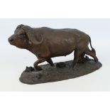 A cold-cast bronze buffalo statue by Robert Glen.