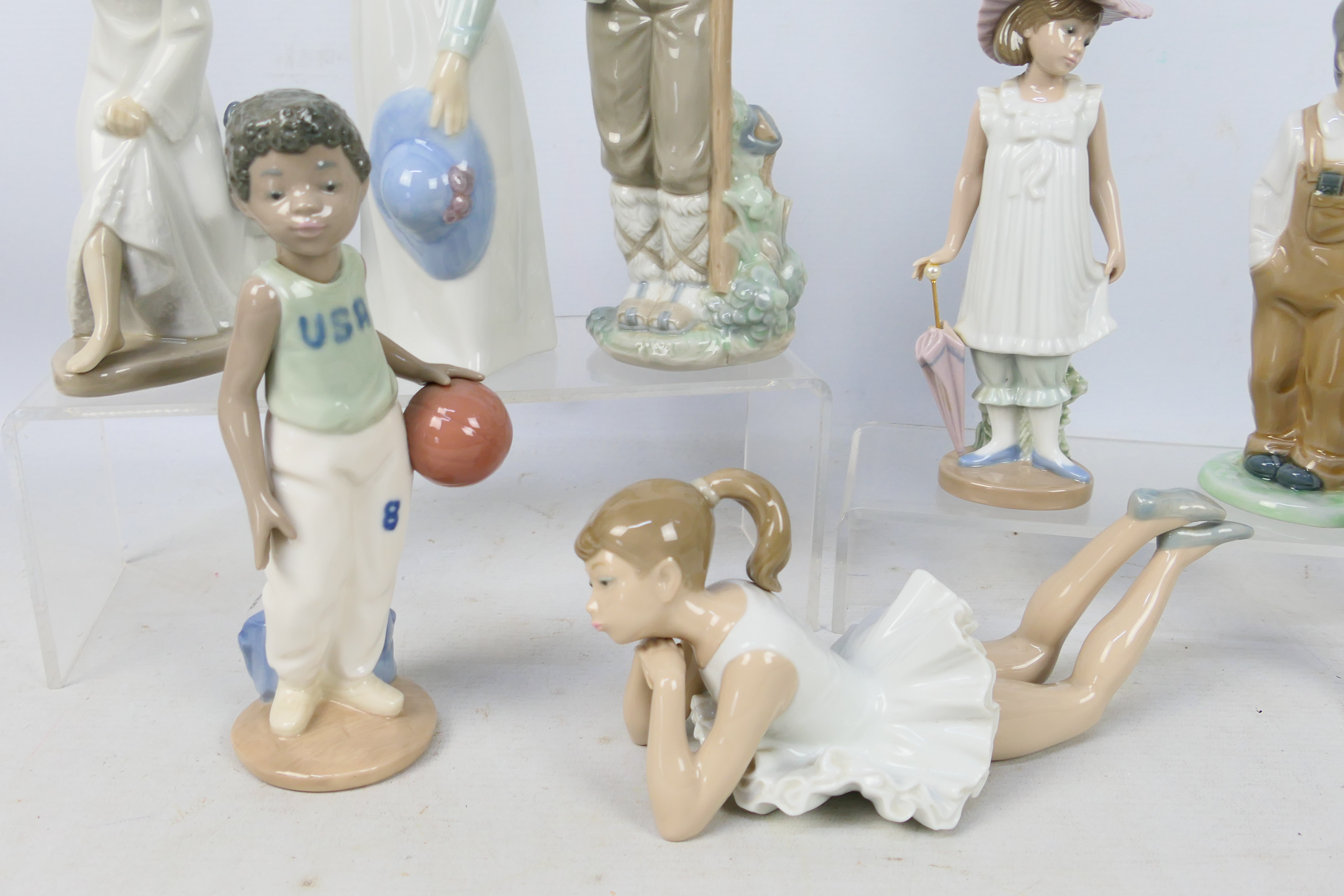 Eight Nao figures depicting children, largest approximately 27 cm (h). - Image 4 of 5