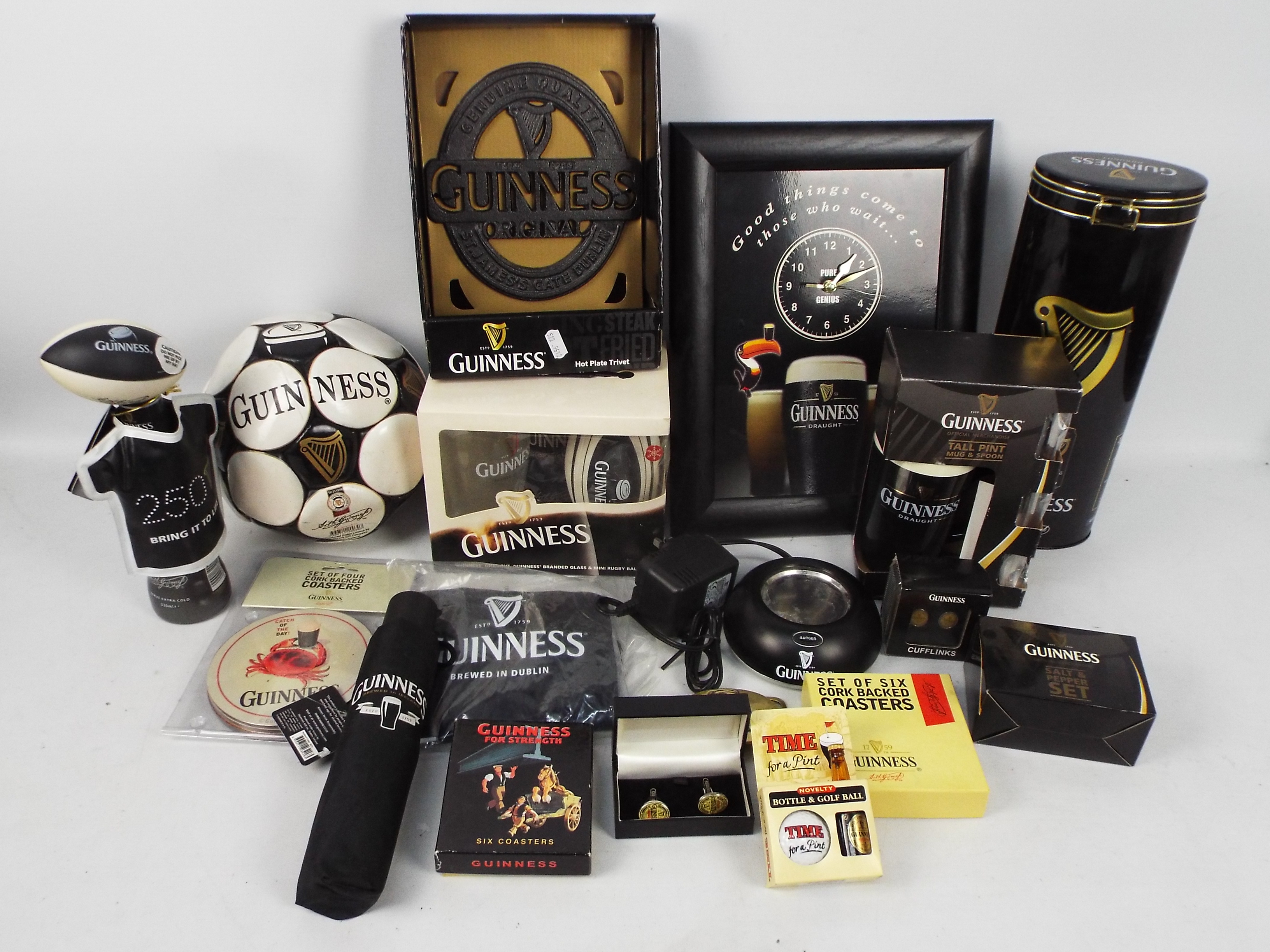 Guinness - A mixed lot of Guinness branded collectables to include gift sets, football, inflatable,