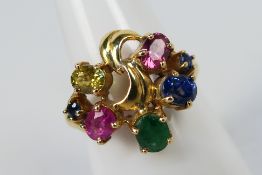 An 18ct multi-stone set fancy dress ring, size Q, approximately 4.