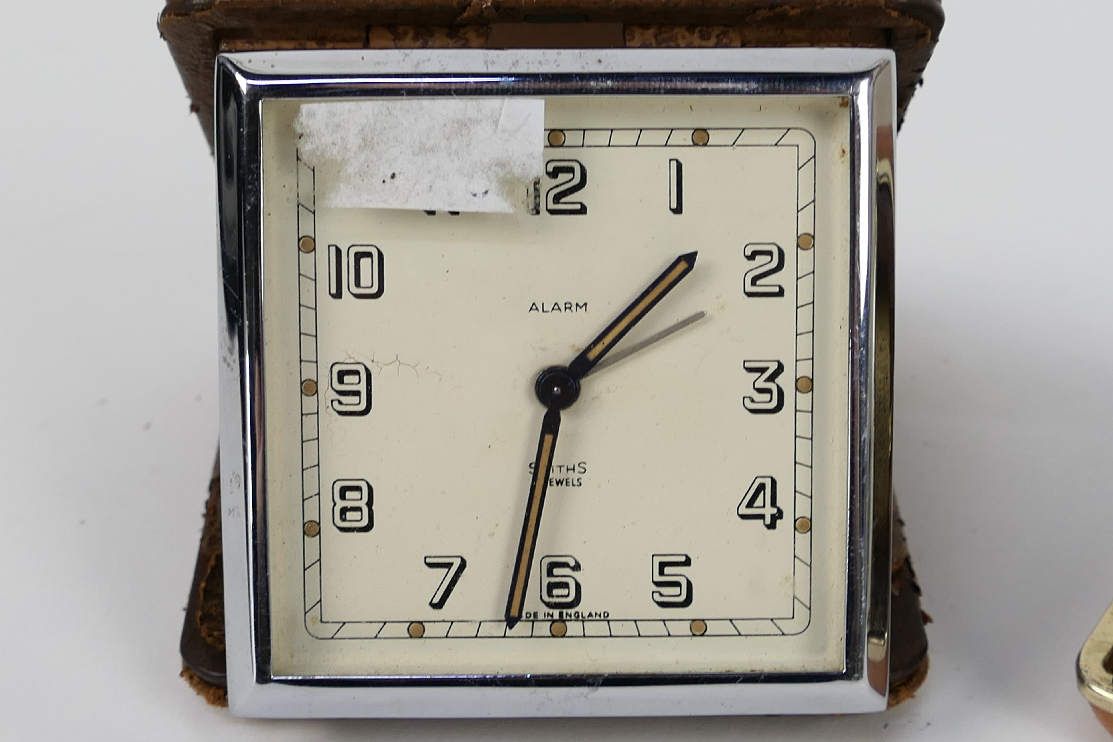 A Smiths Art Deco travel alarm clock in folding leather case, one further travel alarm clock. - Image 2 of 4