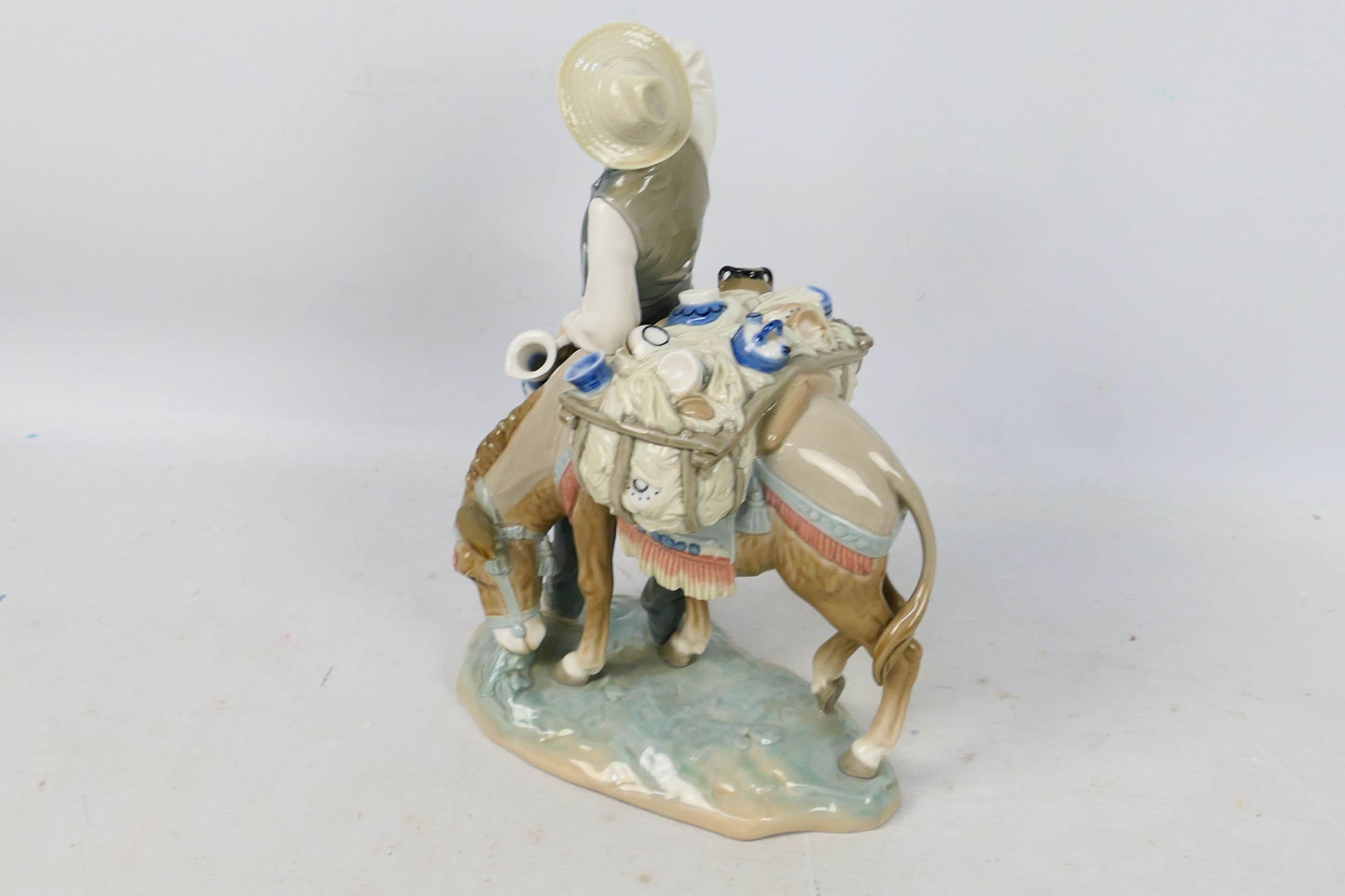 Lladro - A porcelain figural group entitled Peddler # 4859 depicting a pottery seller with his - Image 4 of 5