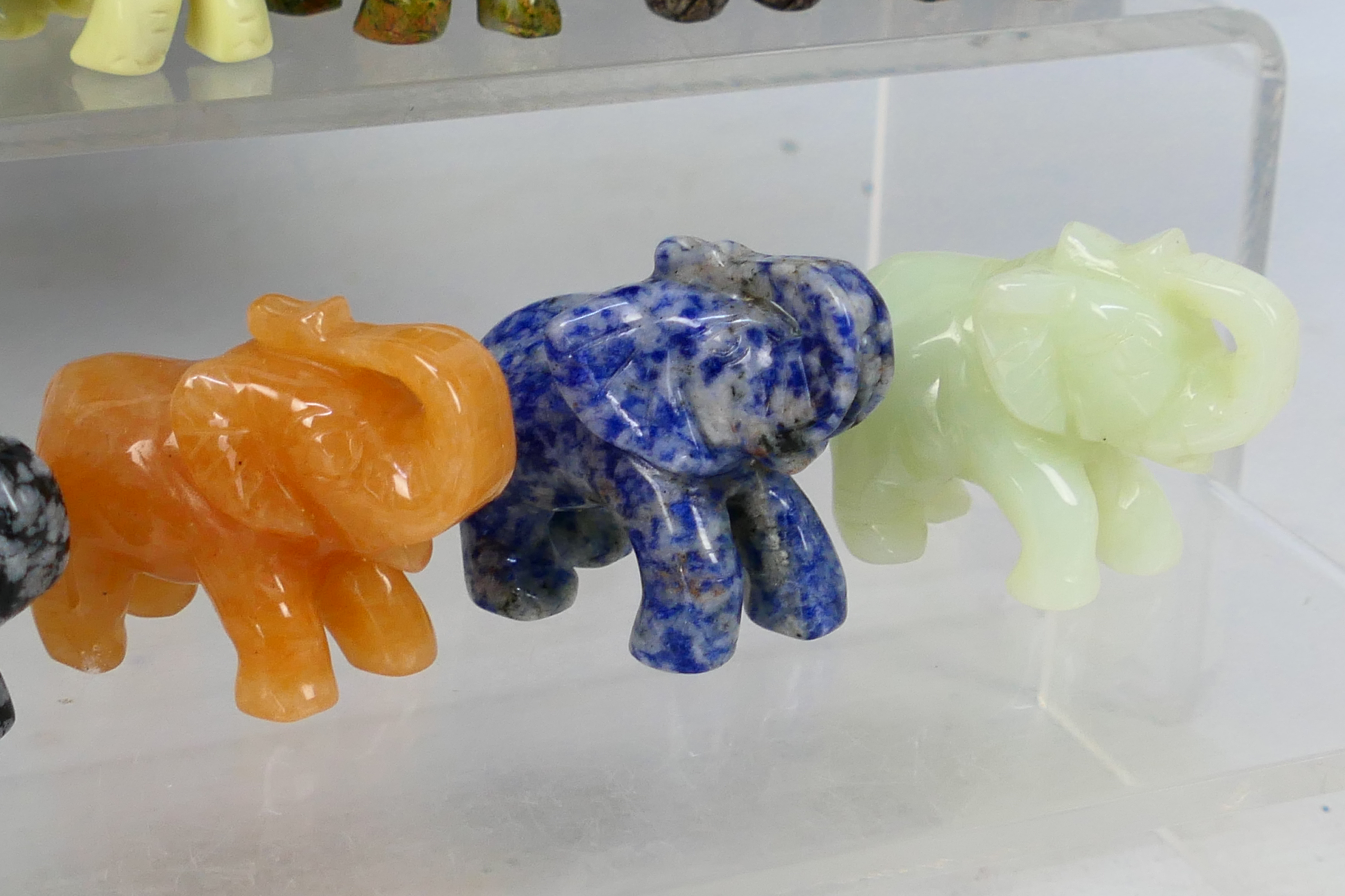 A collection of twelve carved elephants, each carved from a different hardstone, - Image 6 of 7
