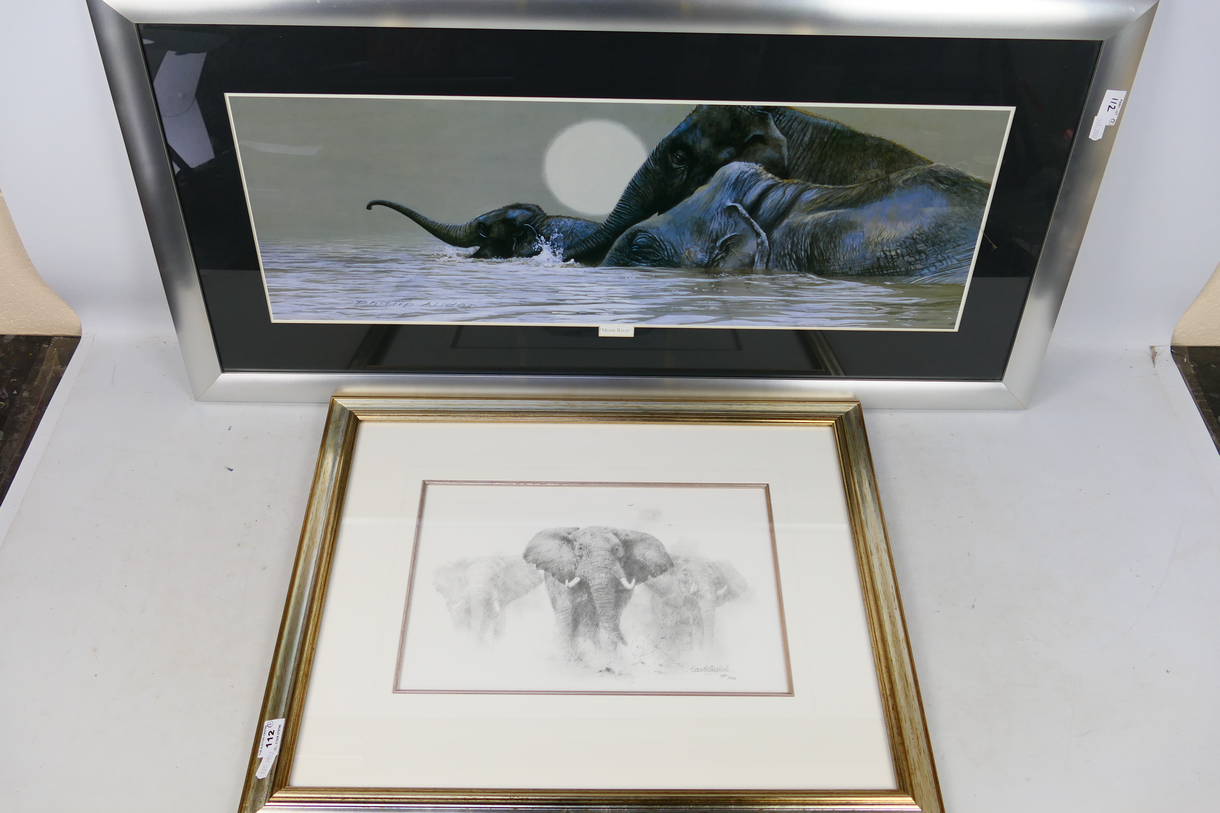 Two framed prints comprising Elephants by David Shepherd issued in a limited edition of 950,