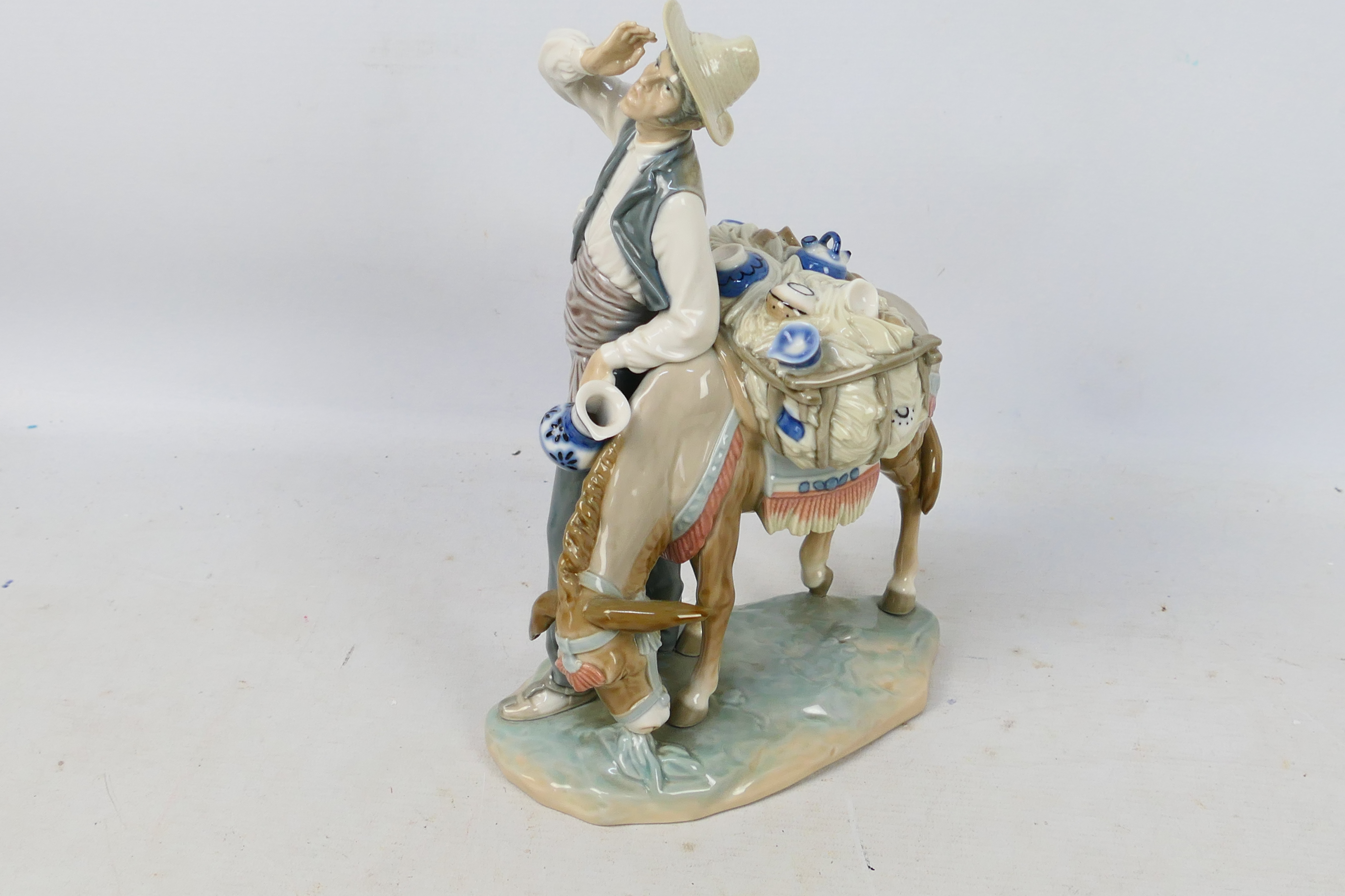 Lladro - A porcelain figural group entitled Peddler # 4859 depicting a pottery seller with his - Image 3 of 5