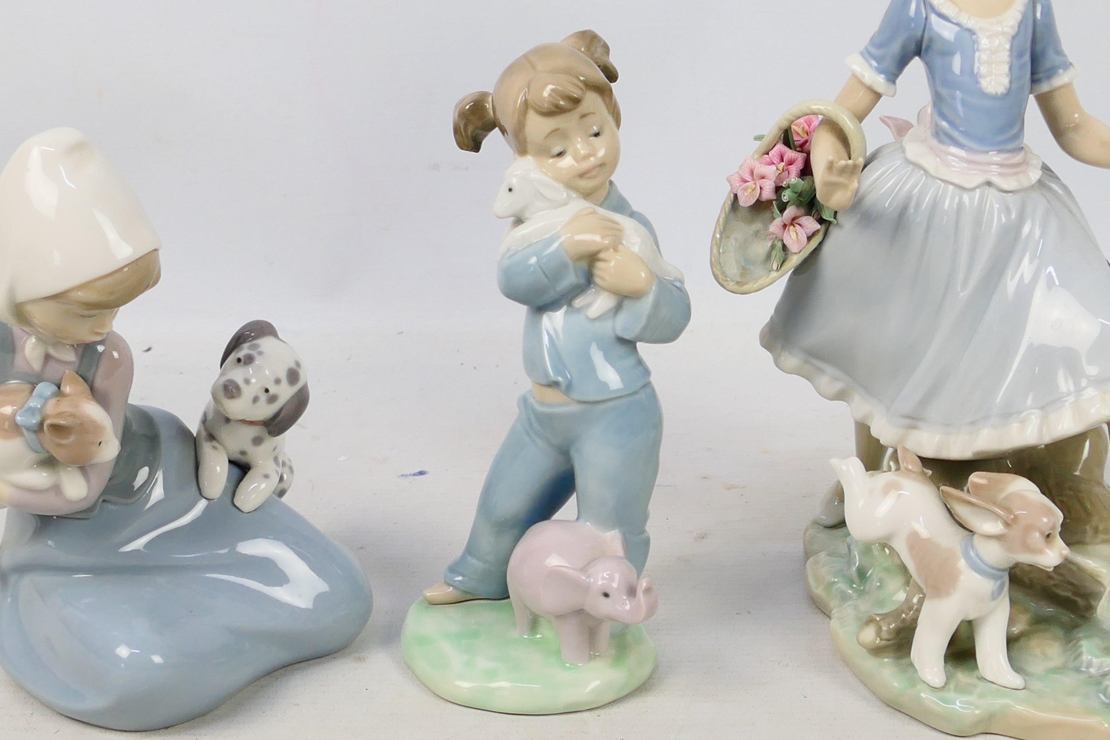 Three Spanish porcelain figures / groups by Lladro and Nao comprising Mirth In The Country # 4920, - Image 3 of 8