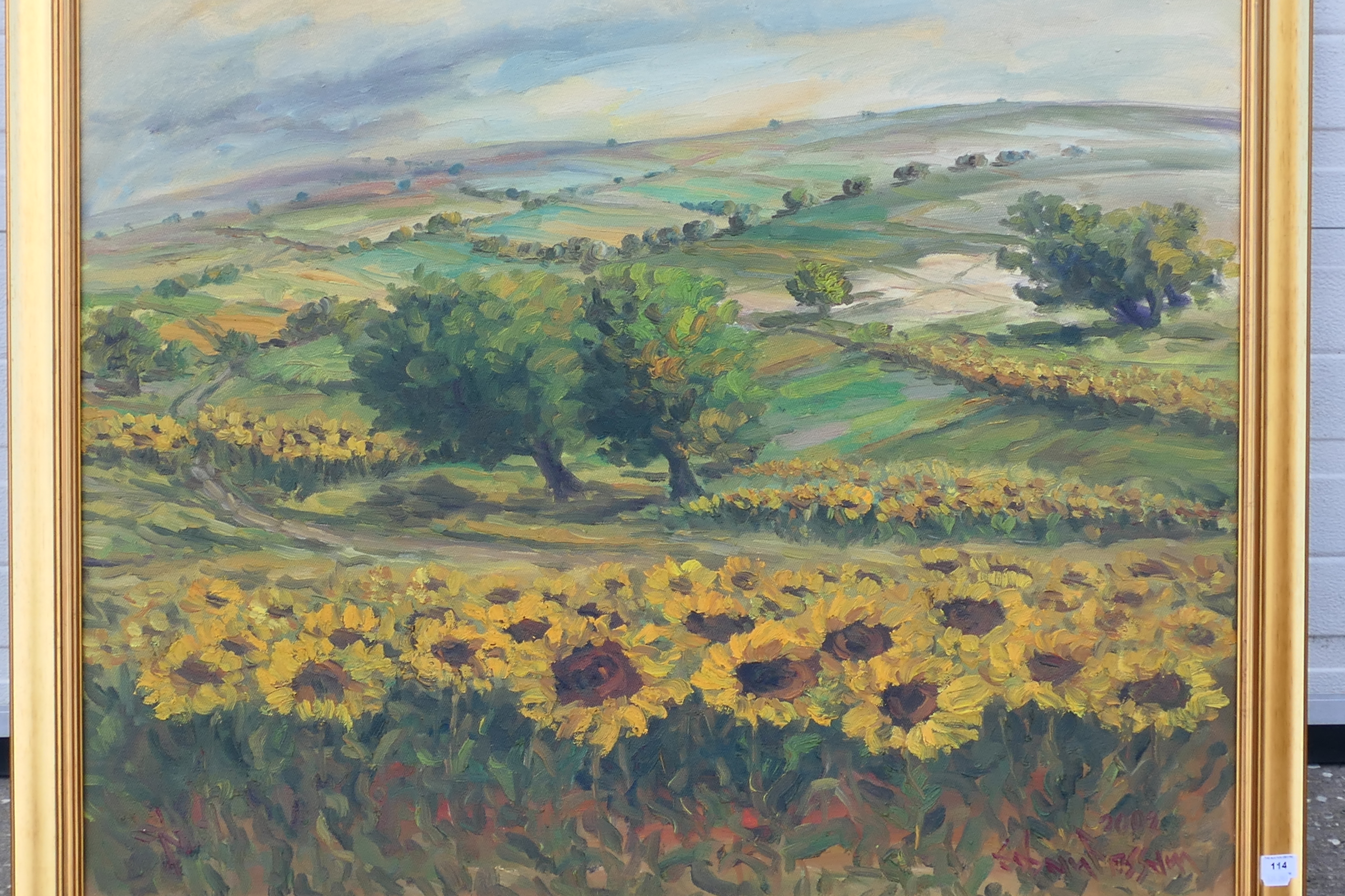A large oil on canvas landscape scene depicting fields of sunflowers, - Image 2 of 3