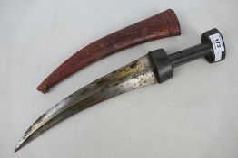 A steel jambiya dagger with 26 cm double edged blade with leather clad scabbard.