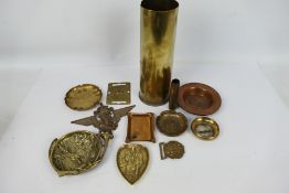 Brass and copper militaria to include trench art, shells, belt buckle and similar.