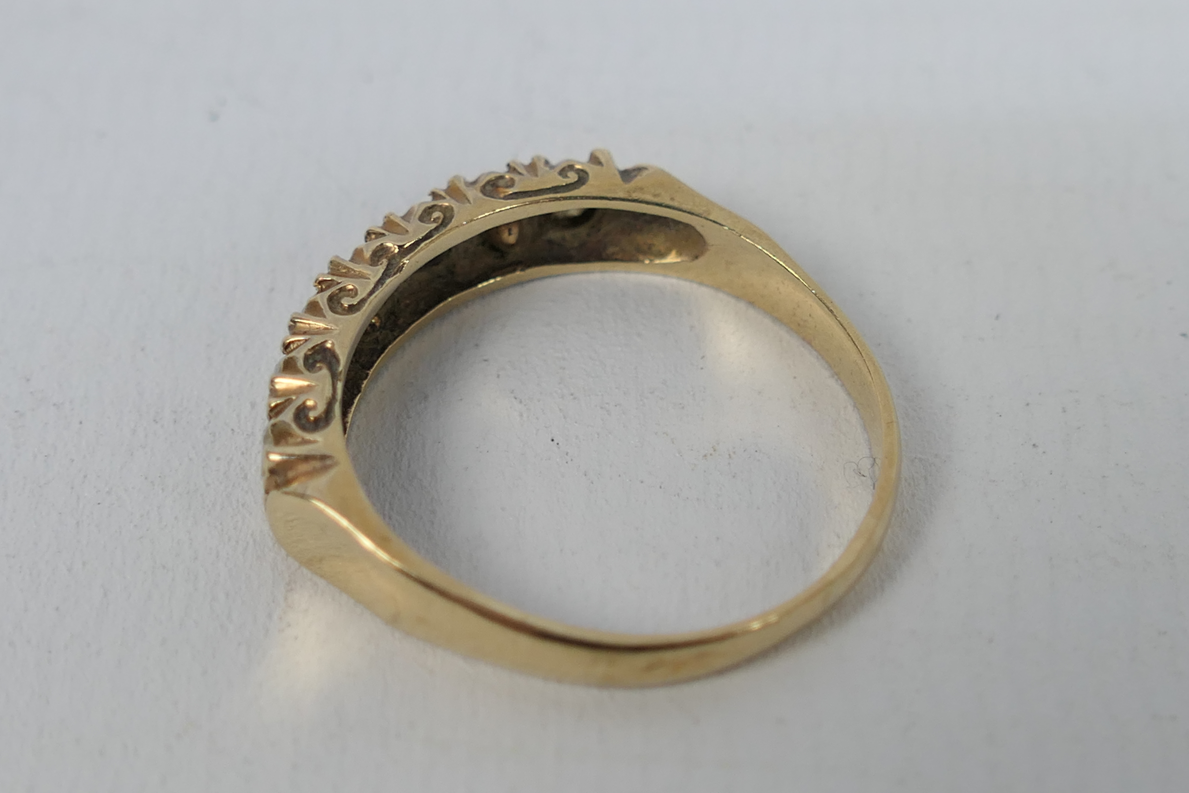 A 9ct gold stone set ring, size O+½, approximately 2.3 grams all in. - Image 2 of 3