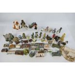 Various ornaments, paperweights and similar, predominantly depicting animals and buildings,