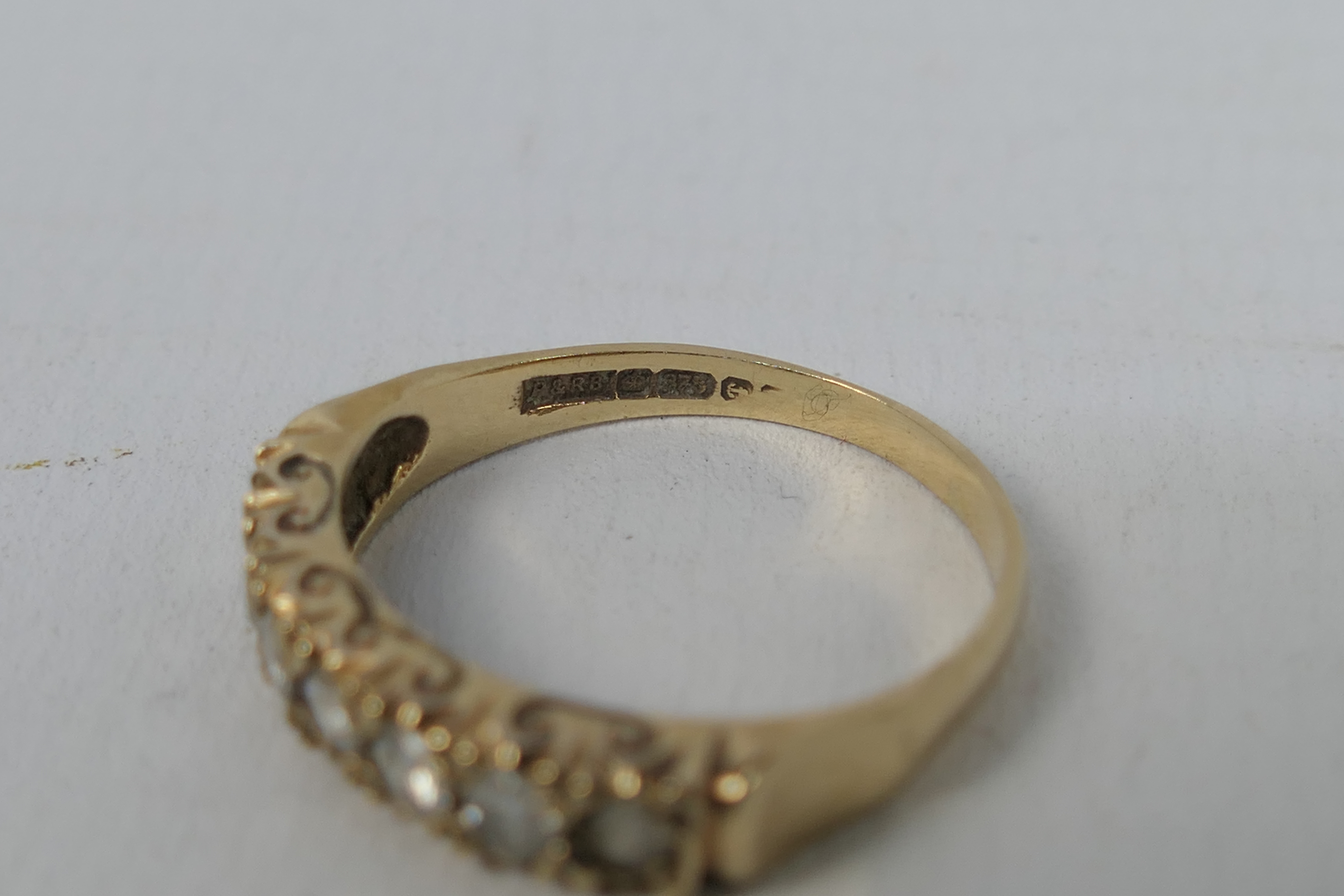 A 9ct gold stone set ring, size O+½, approximately 2.3 grams all in. - Image 3 of 3