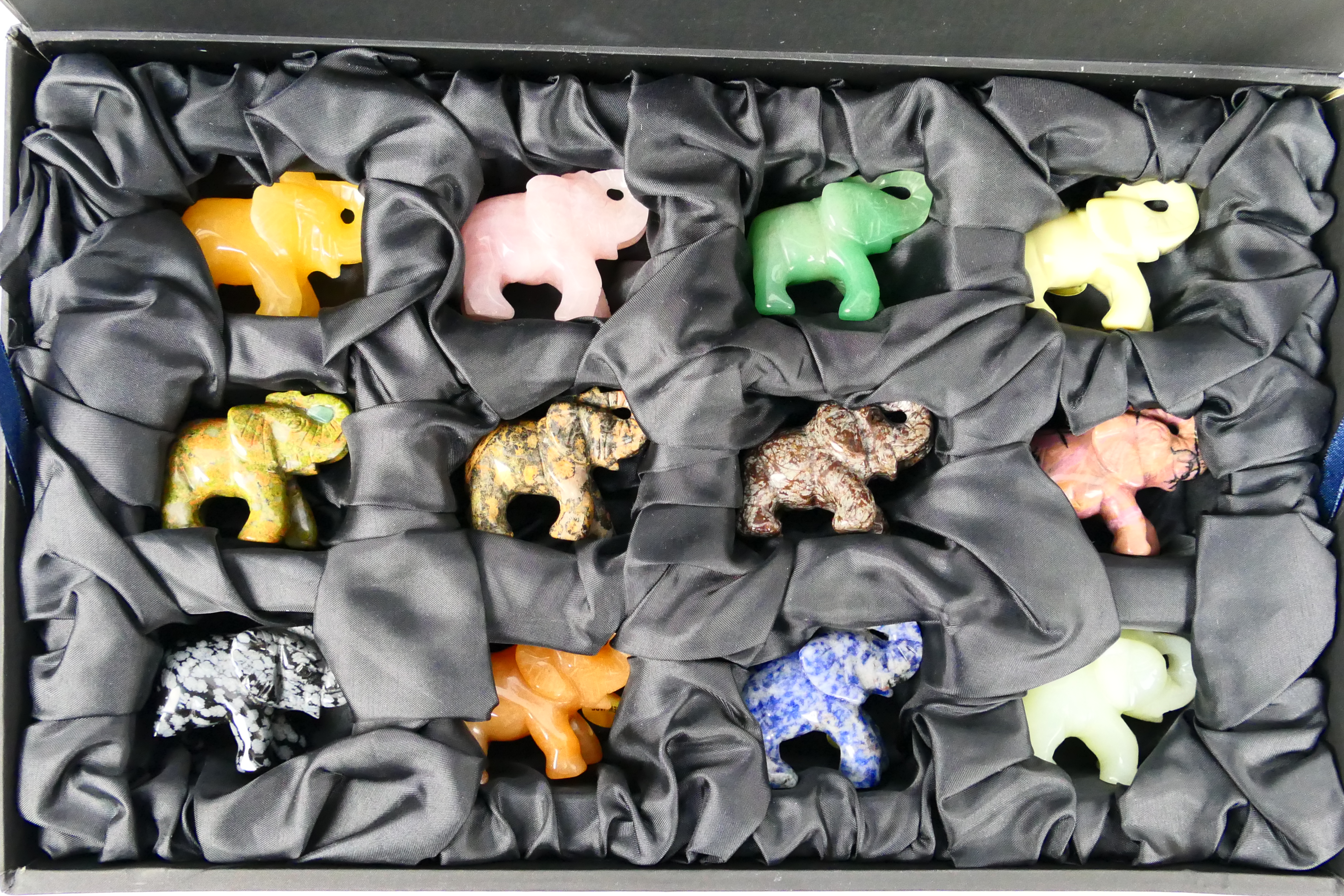 A collection of twelve carved elephants, each carved from a different hardstone, - Image 7 of 7