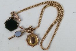 A 9ct gold watch chain and T-bar with 9ct fob attached and 9ct swivel seal, approximately 28.