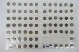 31 silver 6d coins, predominantly post 1919 and a quantity of base metal examples.
