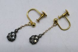 A pair of diamond drop earrings