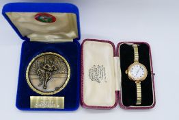 A lady's vintage 9 carat gold cased watch stamped 9; 375,
